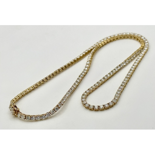 27 - A FABULOUS 10K YELLOW GOLD TENNIS NECKLACE WITH 11.17ctw OF TOP QUALITY LAB GROWN DIAMONDS. D - E IN... 