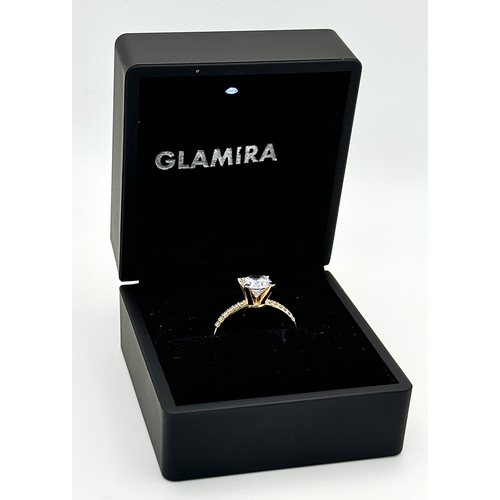 16 - A Glamira 14K Yellow Gold Swarovski Crystal Ring. Size R1/2, 3.93g total weight. Comes with box, pou... 