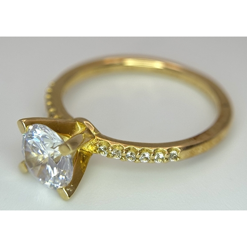 16 - A Glamira 14K Yellow Gold Swarovski Crystal Ring. Size R1/2, 3.93g total weight. Comes with box, pou... 