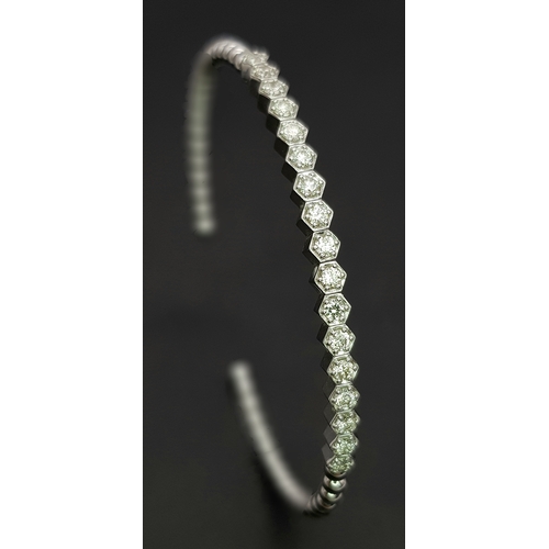 38 - A 14K WHITE GOLD BRACELET BANGLE. SET WITH SEVENTEEN 0.87CT ROUND BRILLIANT CUT NATURAL DIAMONDS. H/... 