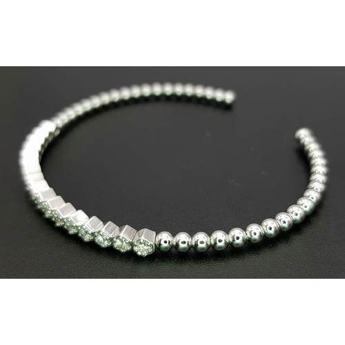 38 - A 14K WHITE GOLD BRACELET BANGLE. SET WITH SEVENTEEN 0.87CT ROUND BRILLIANT CUT NATURAL DIAMONDS. H/... 