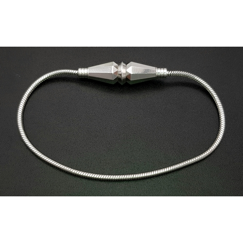 29 - A BUCHERON 18K WHITE GOLD DESIGNER BRACELET.        18.2gms      17cms