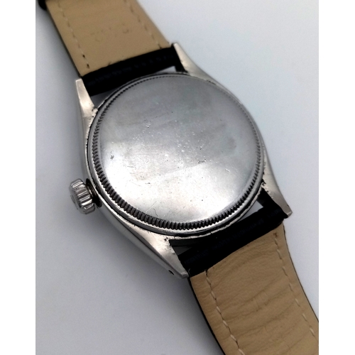 37 - A VINTAGE  ROLEX OYSTER PERPETUAL WATCH WITH RARE WAFFLE DIAL. BLACK LEATHER STRAP. STAINLESS STEEL ... 