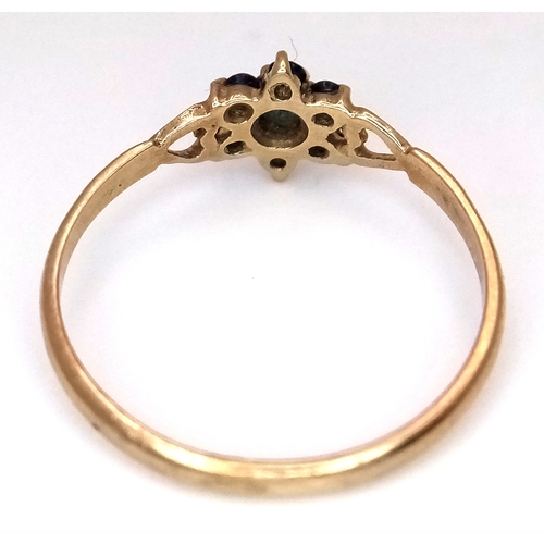 1073 - A Vintage 1984 Hallmarked 9 Carat Gold and Sapphire Cluster Ring Size P. The Ring measures 7mm Wide ... 