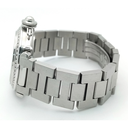 31 - A Pasha de Cartier Diamond Ladies Watch. Stainless steel bracelet and case - 36mm. Diamond encrusted... 