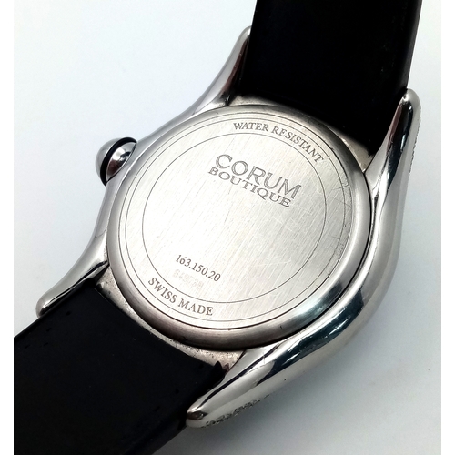 59 - A Corum Bubble, Diamond Gents Watch. Model 163.150.20. 
Black leather and rubber strap - With a Coru... 