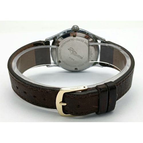 60 - A Vintage Helvetia Mechanical Gents Watch. Brown leather strap. Stainless steel case - 35mm. White d... 