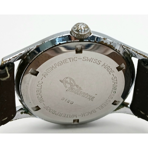 60 - A Vintage Helvetia Mechanical Gents Watch. Brown leather strap. Stainless steel case - 35mm. White d... 