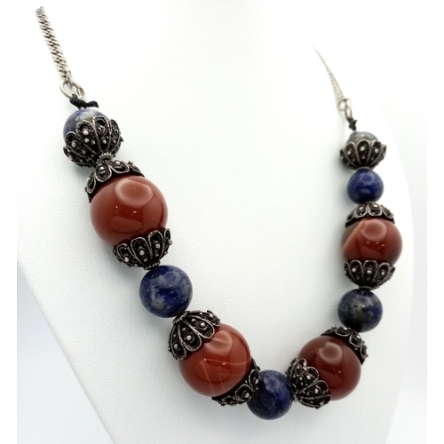 1062 - A vintage 925 silver Lapis Lazuli and Carnelian link necklace. Total length 54cm.