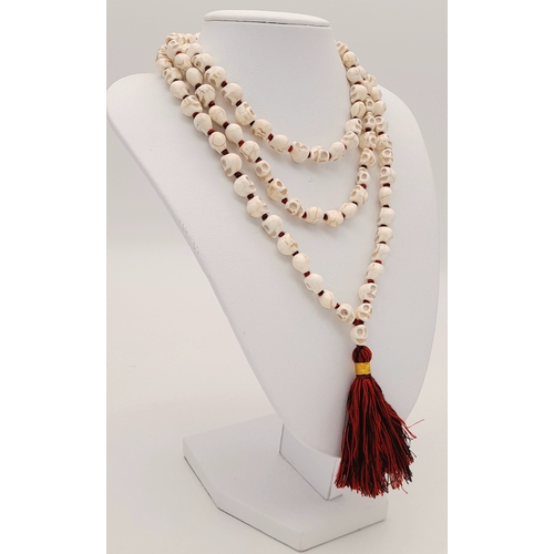 1081 - A matinee length of Skull Mala prayer bead link necklace. Total length 96cm.