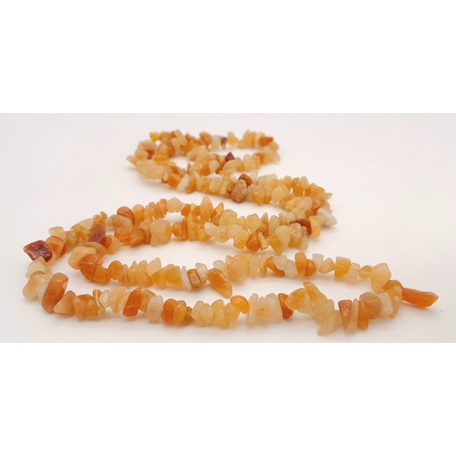 1109 - A matinee length of irregular agate necklace. Total length 86cm.