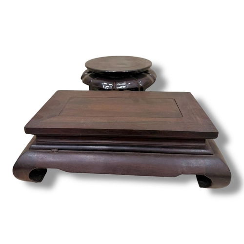 1113 - A solid Wooden Display Stand.
Dark-stained hardwood exterior with a stepped rectangular platform and... 