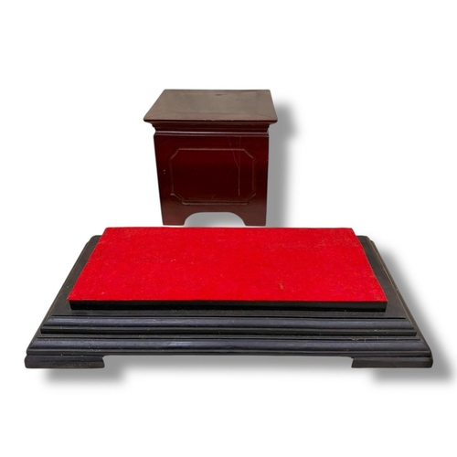 1120 - A Wooden Display Stand with Red Felt Top.
Dark-stained hardwood exterior with a stepped rectangular ... 