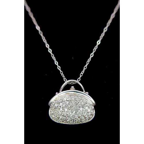 1070 - A 14K White Gold and Diamond Handbag Pendant on a 9K White Gold Chain. 18mm and 44cm. 3.4g. Ref: 6.3