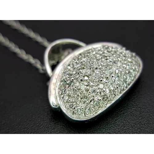1070 - A 14K White Gold and Diamond Handbag Pendant on a 9K White Gold Chain. 18mm and 44cm. 3.4g. Ref: 6.3