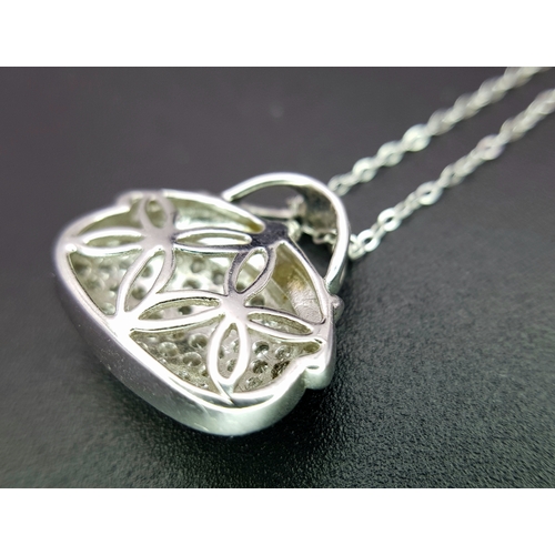 1070 - A 14K White Gold and Diamond Handbag Pendant on a 9K White Gold Chain. 18mm and 44cm. 3.4g. Ref: 6.3