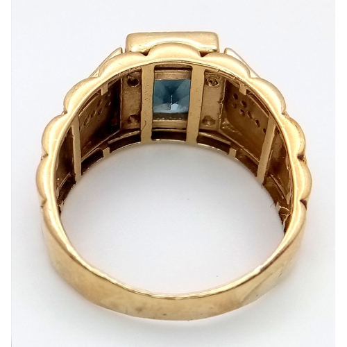 1096 - A 14K Yellow Gold Fancy Blue Topaz Signet Ring. Size R. 7.15g total weight.