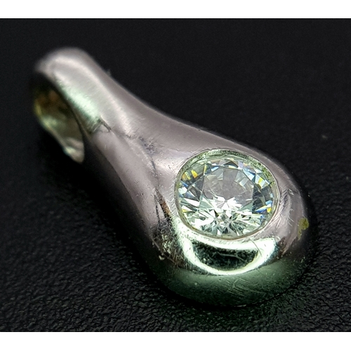 1111 - A 9K WHITE GOLD STONE SET PENDANT .     1.2gms