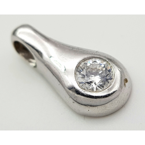 1111 - A 9K WHITE GOLD STONE SET PENDANT .     1.2gms