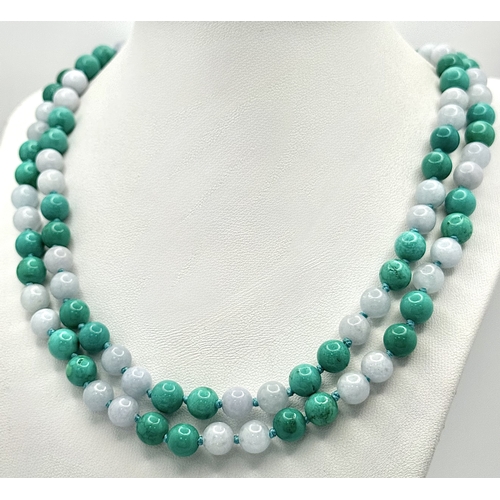 1098 - A Matinee Length Turquoise and Aquamarine Necklace. 8mm beads. 88cm necklace length.