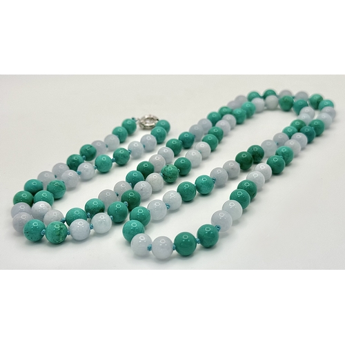 1098 - A Matinee Length Turquoise and Aquamarine Necklace. 8mm beads. 88cm necklace length.