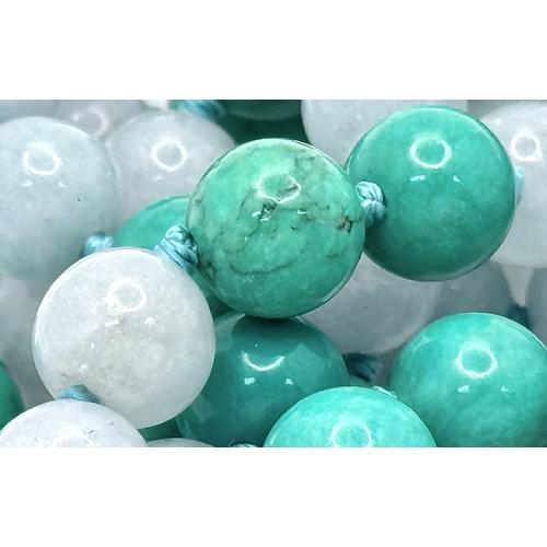 1098 - A Matinee Length Turquoise and Aquamarine Necklace. 8mm beads. 88cm necklace length.