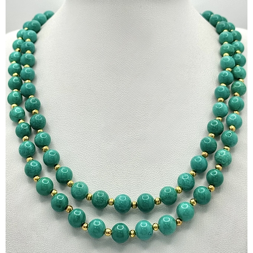 1112 - A Two Row Turquoise Beaded Necklace. Gilded spacers and clasp. 8mm beads. 42-46cm necklace length.