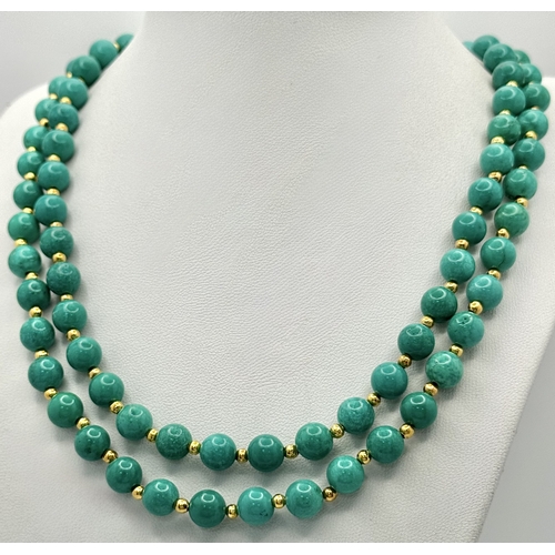 1112 - A Two Row Turquoise Beaded Necklace. Gilded spacers and clasp. 8mm beads. 42-46cm necklace length.