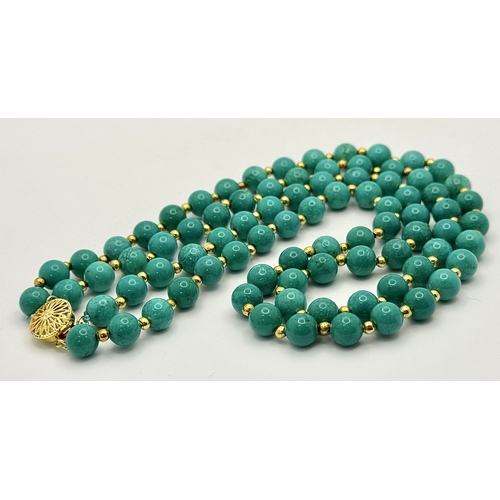 1112 - A Two Row Turquoise Beaded Necklace. Gilded spacers and clasp. 8mm beads. 42-46cm necklace length.