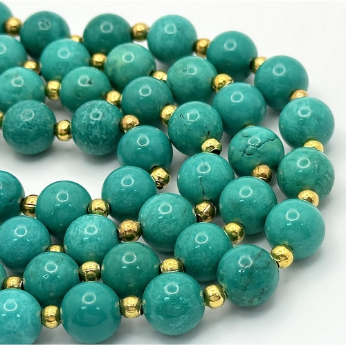 1112 - A Two Row Turquoise Beaded Necklace. Gilded spacers and clasp. 8mm beads. 42-46cm necklace length.