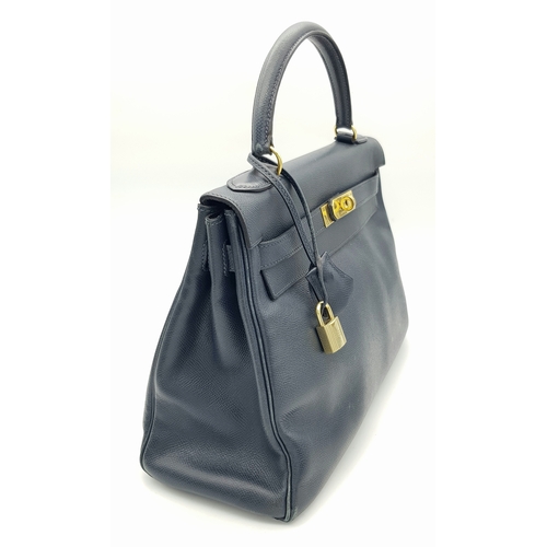 13 - A Hermès Midnight Blue Leather Kelly Top Handle Bag. Midnight Blue leather exterior with gold-toned ... 