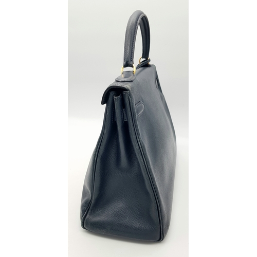 13 - A Hermès Midnight Blue Leather Kelly Top Handle Bag. Midnight Blue leather exterior with gold-toned ... 