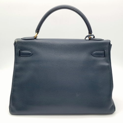 13 - A Hermès Midnight Blue Leather Kelly Top Handle Bag. Midnight Blue leather exterior with gold-toned ... 