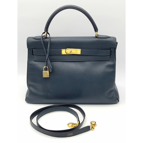 13 - A Hermès Midnight Blue Leather Kelly Top Handle Bag. Midnight Blue leather exterior with gold-toned ... 