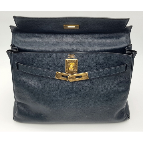 13 - A Hermès Midnight Blue Leather Kelly Top Handle Bag. Midnight Blue leather exterior with gold-toned ... 