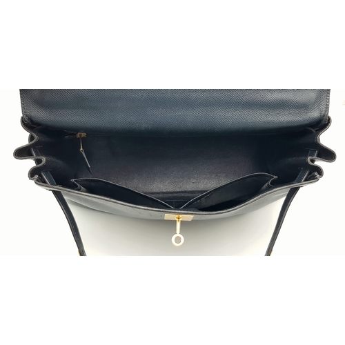13 - A Hermès Midnight Blue Leather Kelly Top Handle Bag. Midnight Blue leather exterior with gold-toned ... 