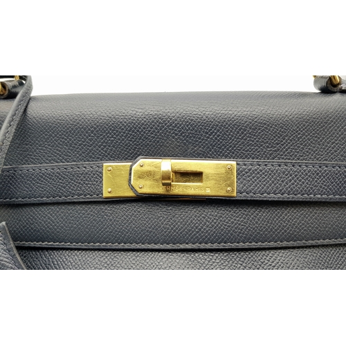 13 - A Hermès Midnight Blue Leather Kelly Top Handle Bag. Midnight Blue leather exterior with gold-toned ... 
