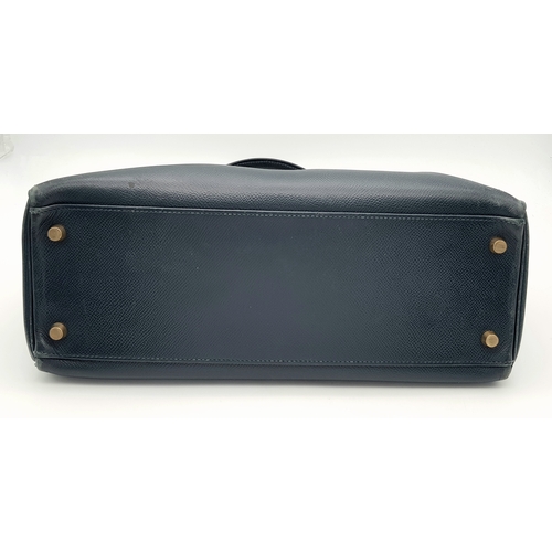 13 - A Hermès Midnight Blue Leather Kelly Top Handle Bag. Midnight Blue leather exterior with gold-toned ... 