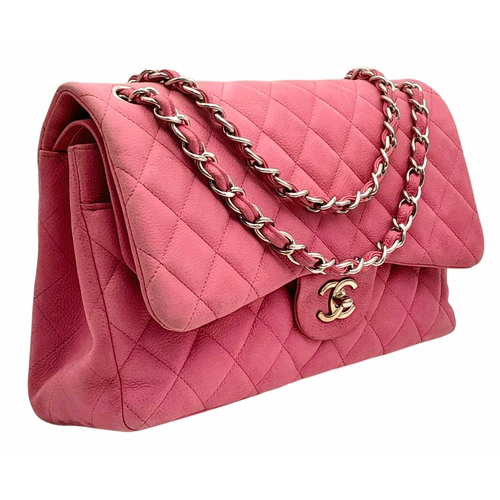 A Chanel Pink Quilted Caviar Leather Double Flap Bag. Pink leather exterior with silver-tone hardware, attachable  shoulder strap and turn-lock closure. Pink leather interior with a main compartment, two slip pockets. Some signs of wear and stains to the exterior and interior. Approx 30cm length x 18cm height x 8cm depth. Please see photos or request a condition report.  STK026130