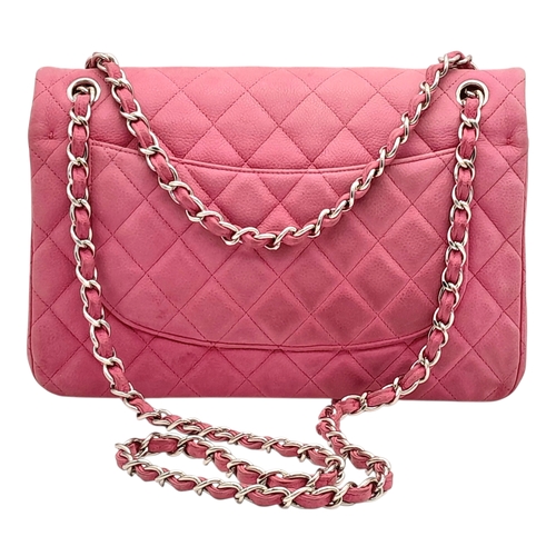 27 - A Chanel Pink Quilted Caviar Leather Double Flap Bag. Pink leather exterior with silver-tone hardwar... 