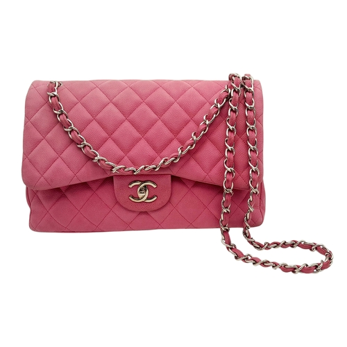 27 - A Chanel Pink Quilted Caviar Leather Double Flap Bag. Pink leather exterior with silver-tone hardwar... 