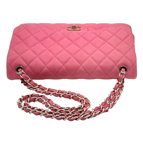 27 - A Chanel Pink Quilted Caviar Leather Double Flap Bag. Pink leather exterior with silver-tone hardwar... 