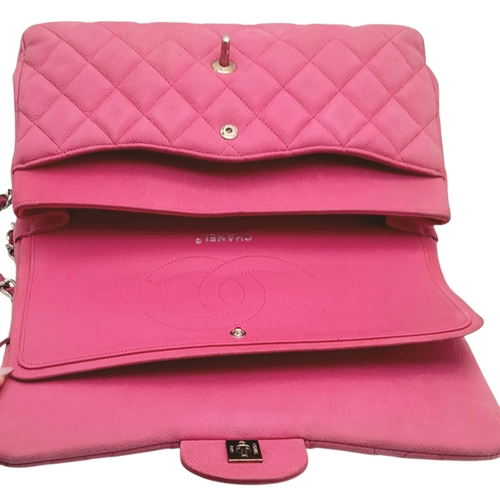 27 - A Chanel Pink Quilted Caviar Leather Double Flap Bag. Pink leather exterior with silver-tone hardwar... 