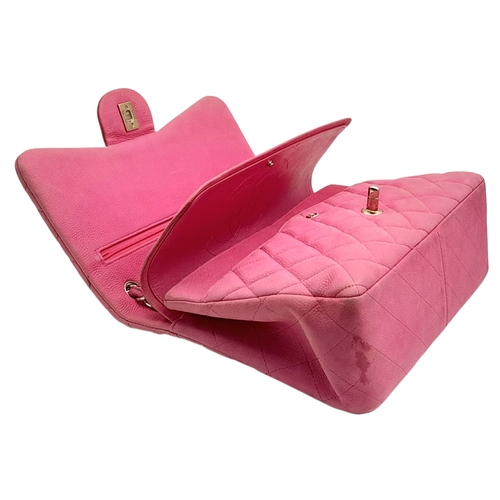 27 - A Chanel Pink Quilted Caviar Leather Double Flap Bag. Pink leather exterior with silver-tone hardwar... 