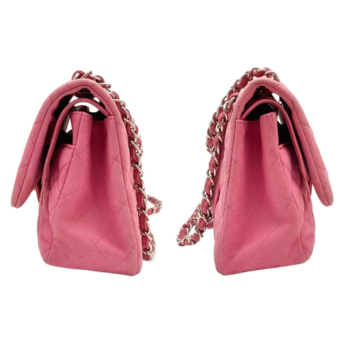 27 - A Chanel Pink Quilted Caviar Leather Double Flap Bag. Pink leather exterior with silver-tone hardwar... 