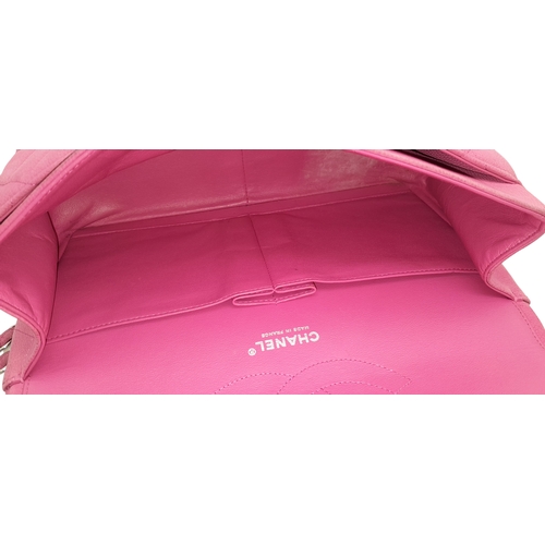 27 - A Chanel Pink Quilted Caviar Leather Double Flap Bag. Pink leather exterior with silver-tone hardwar... 
