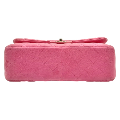 27 - A Chanel Pink Quilted Caviar Leather Double Flap Bag. Pink leather exterior with silver-tone hardwar... 