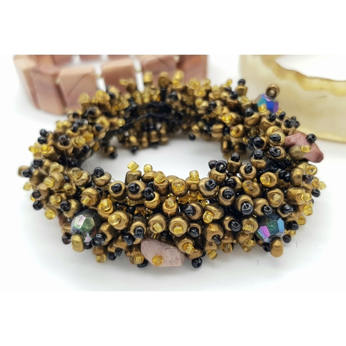 1616 - 3x vintage Fashion Bracelets. 
Including a horn-style bangle, a multi-strand beaded bracelet with go... 