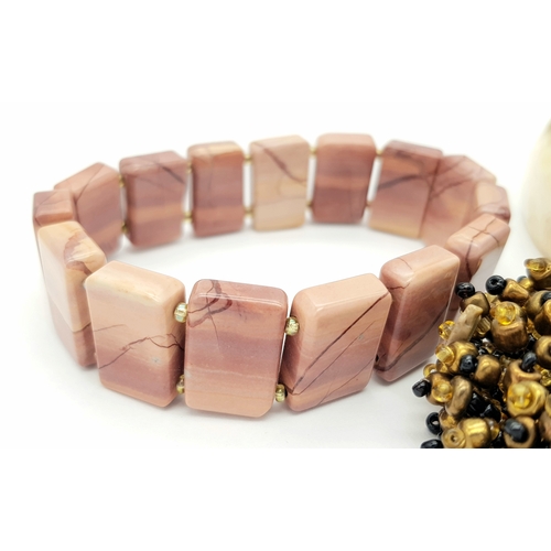 1616 - 3x vintage Fashion Bracelets. 
Including a horn-style bangle, a multi-strand beaded bracelet with go... 