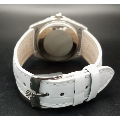 46 - A Custom Rolex Datejust with a Diamond-Paved Dial. White leather strap. Stainless steel case - 36mm.... 